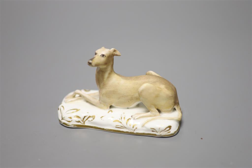 A Grainger, Lee & Co., Worcester porcelain greyhound, cushion base, c.1830, width 10cm